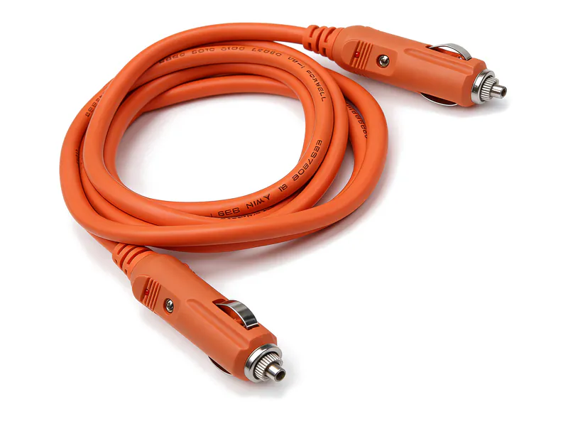 Coiled orange 12 V power cable with a cigarette-lighter plug on each end